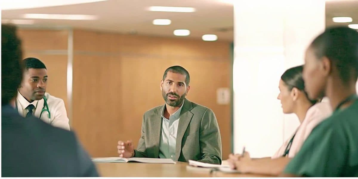 Healthcare administrator leading a team in a hospital